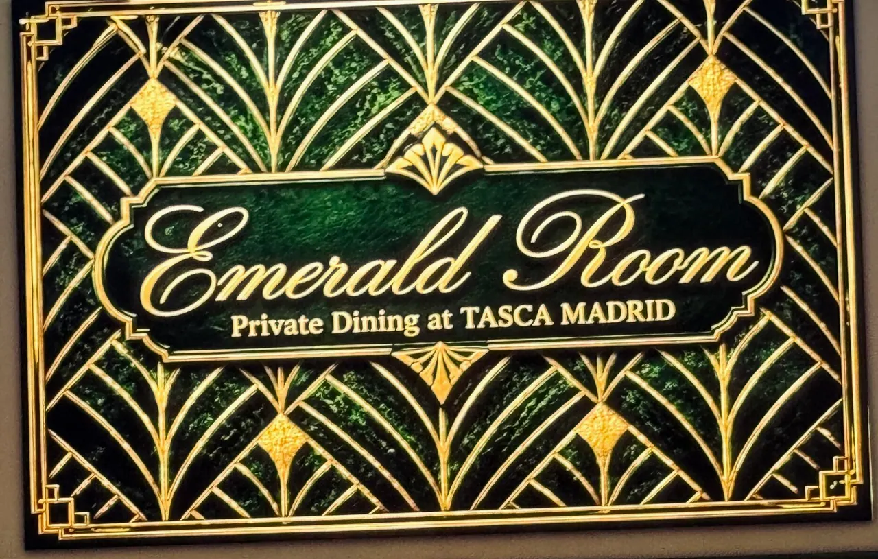 The gold art-deco sign reading Emerald Room, Private Dining at Tasca Madrid